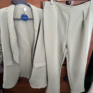 2 piece matching long blazer and pant set. Brand new, never worn.